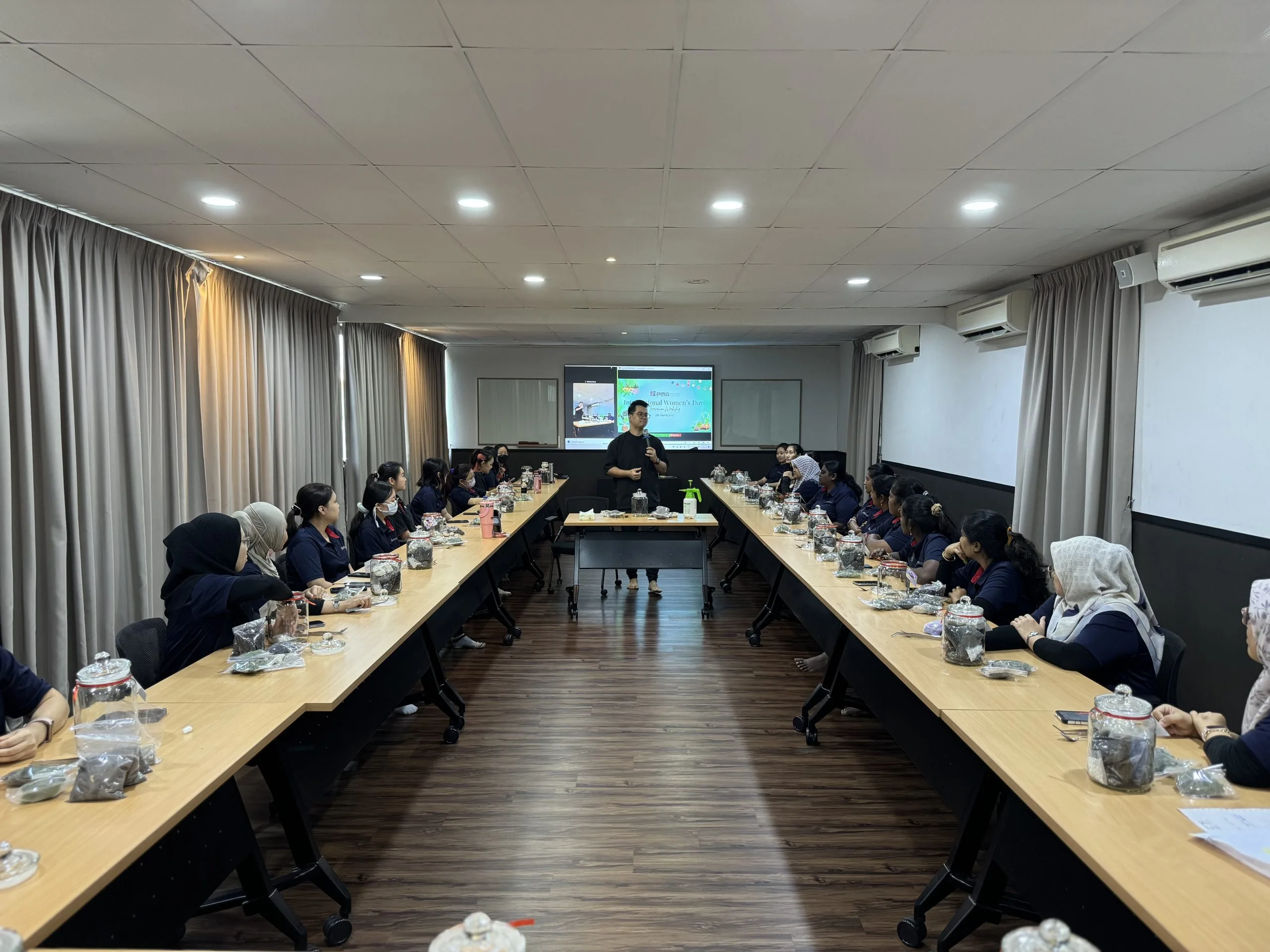 Corporate team building workshop hosted by Mossarium in March 2025, fostering collaboration and creativity through terrarium-making activities.