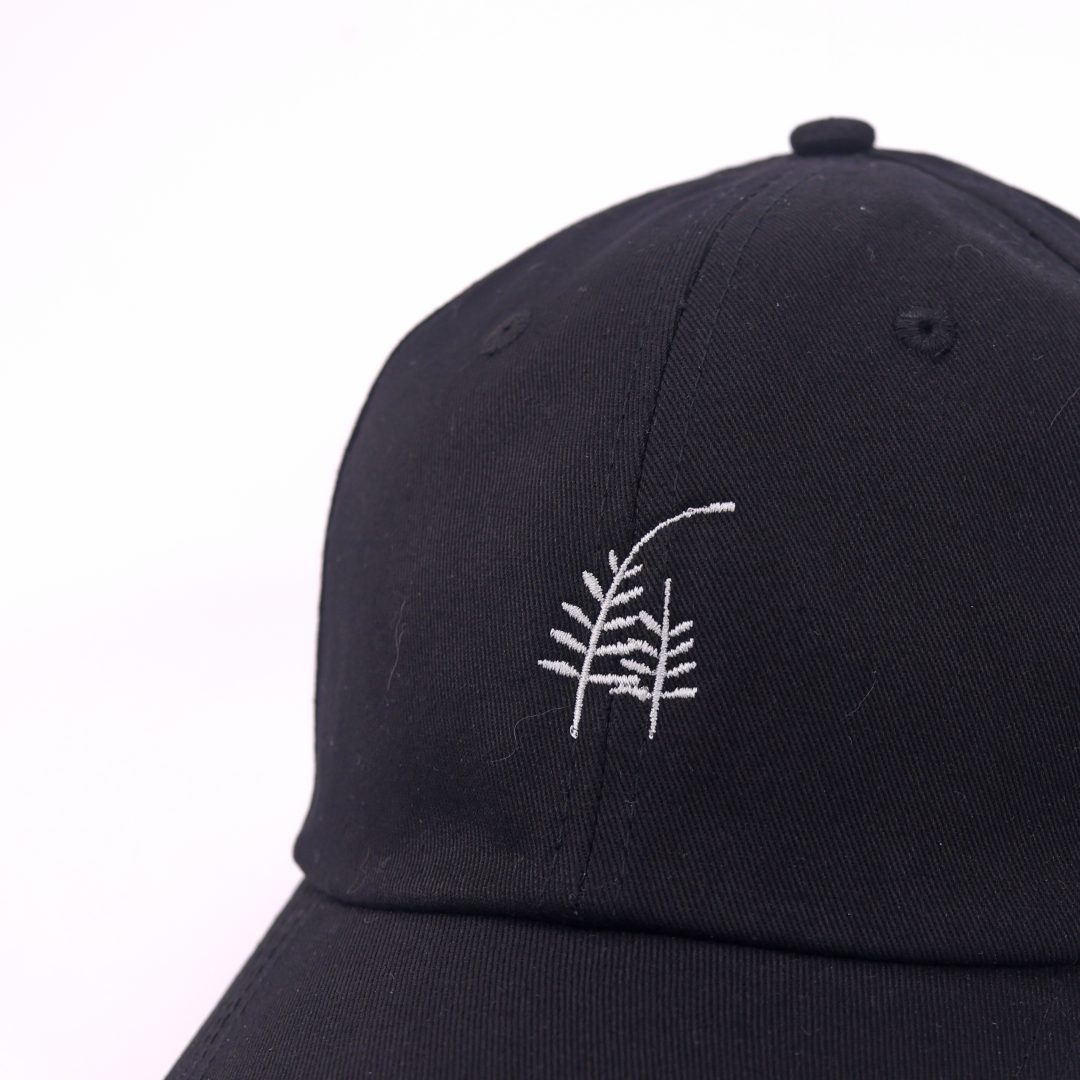Mossarium unisex black cap with embroidered leaf design
